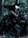 Robe noire fendue en tulle brodé de fleurs années 1970