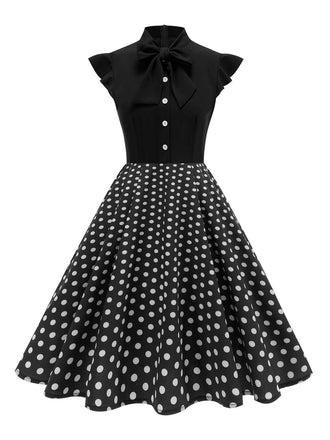 Robe noire trapèze à pois col nœud manches cape années 1950