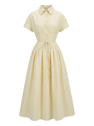 Robe jaune à col boutonné et ceinture à nouer années 1940