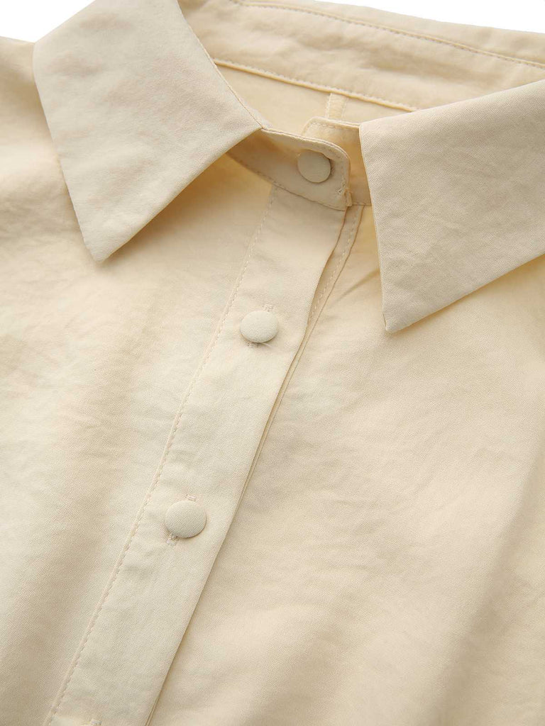 Robe jaune à col boutonné et ceinture à nouer années 1940