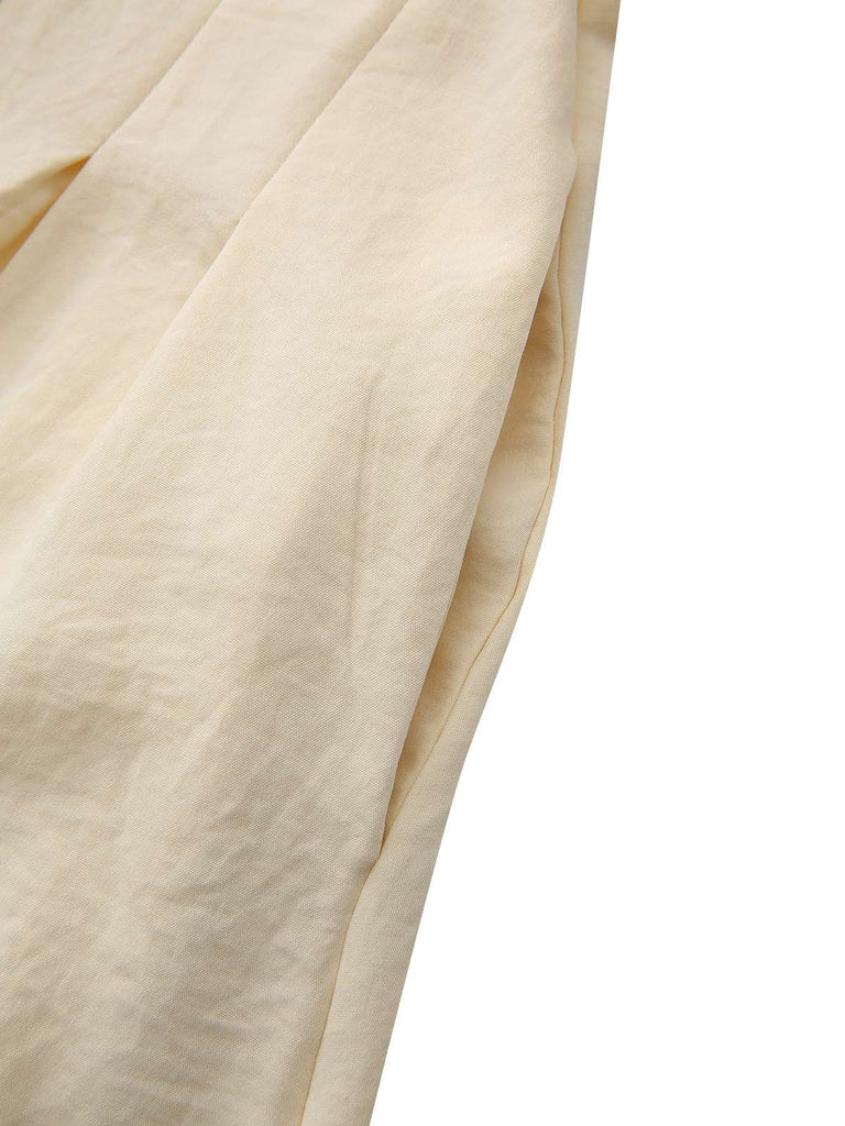 Robe jaune à col boutonné et ceinture à nouer années 1940