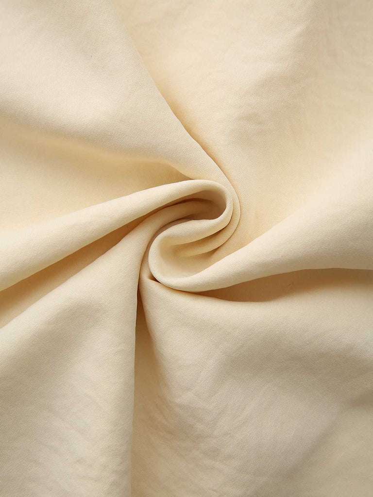 Robe jaune à col boutonné et ceinture à nouer années 1940