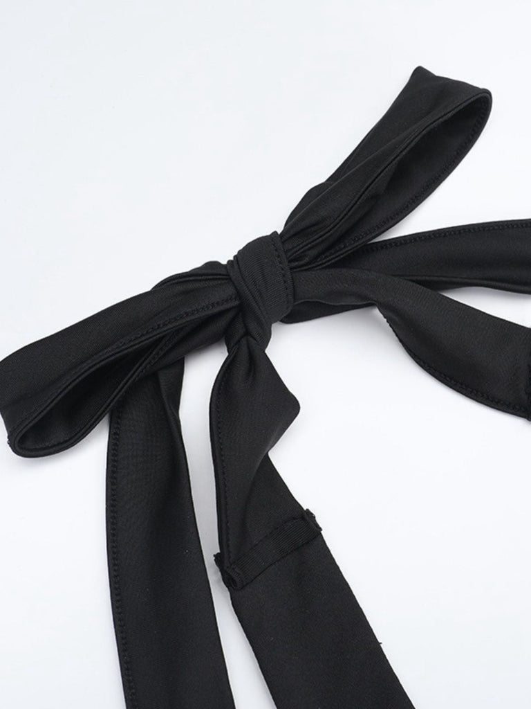 Combinaison noire évasée dos nu à bretelles années 80