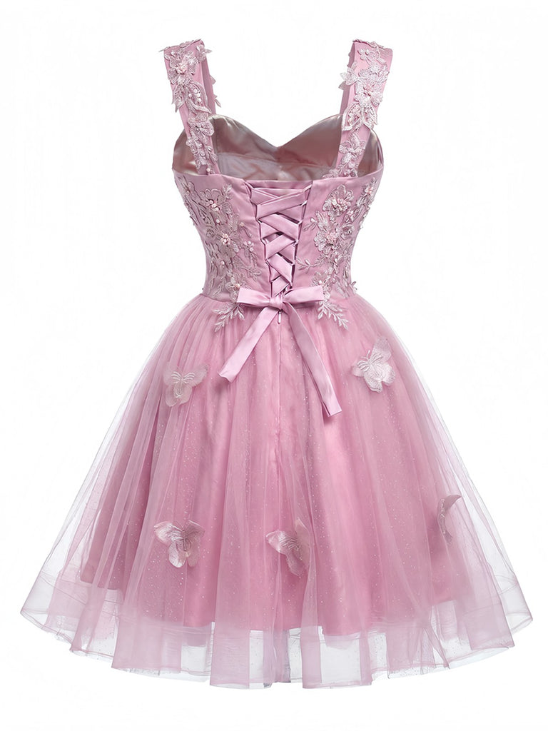 Robe courte rose à paillettes et papillons années 60