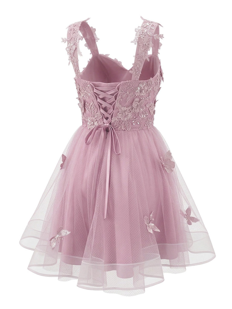 Robe courte rose à paillettes et papillons années 60