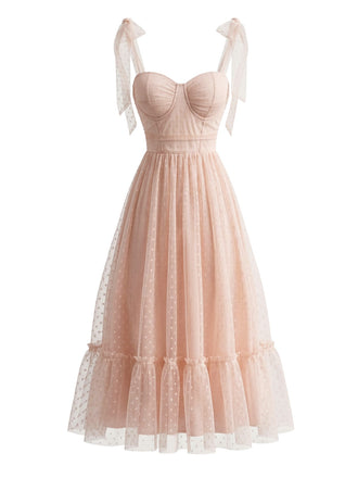 Robe rose foncé pois suisses et manches bouffantes années 1950