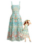 Robe smockée et ceinturée vert givré motif plantes tropicales années 70