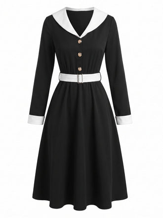 Robe noire et blanche à revers, col V et manches longues années 1950