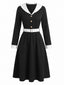 Robe bicolore noir et blanc manches longues col V et revers années 50