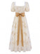 Robe longue à fleurs brodées, nœud et manches bouffantes années 1970