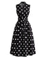 Robe noire à pois sans manches revers et ceinture Années 1950