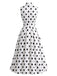 Robe à pois sans manches, revers, nœud et ceinture Années 1950