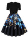 Robe trapèze noire à imprimé papillons et manches bouffantes années 1940 - 1