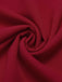 Combinaison rouge à col en V et cravate unie des années 1930