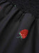 Combishort noire à manches bouffantes framboise des années 1950