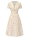 Robe beige à manches bouffantes et revers fleuris des années 1940
