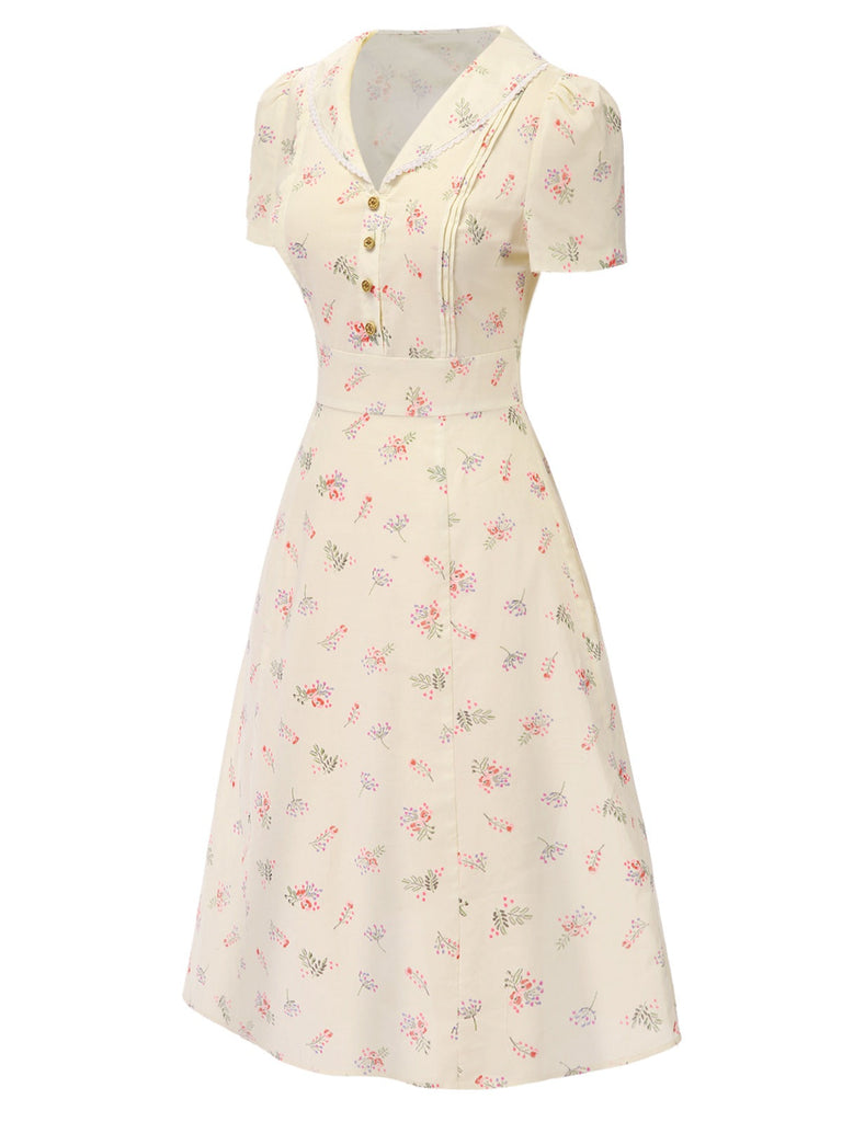 Robe beige à manches bouffantes et revers fleuris des années 1940