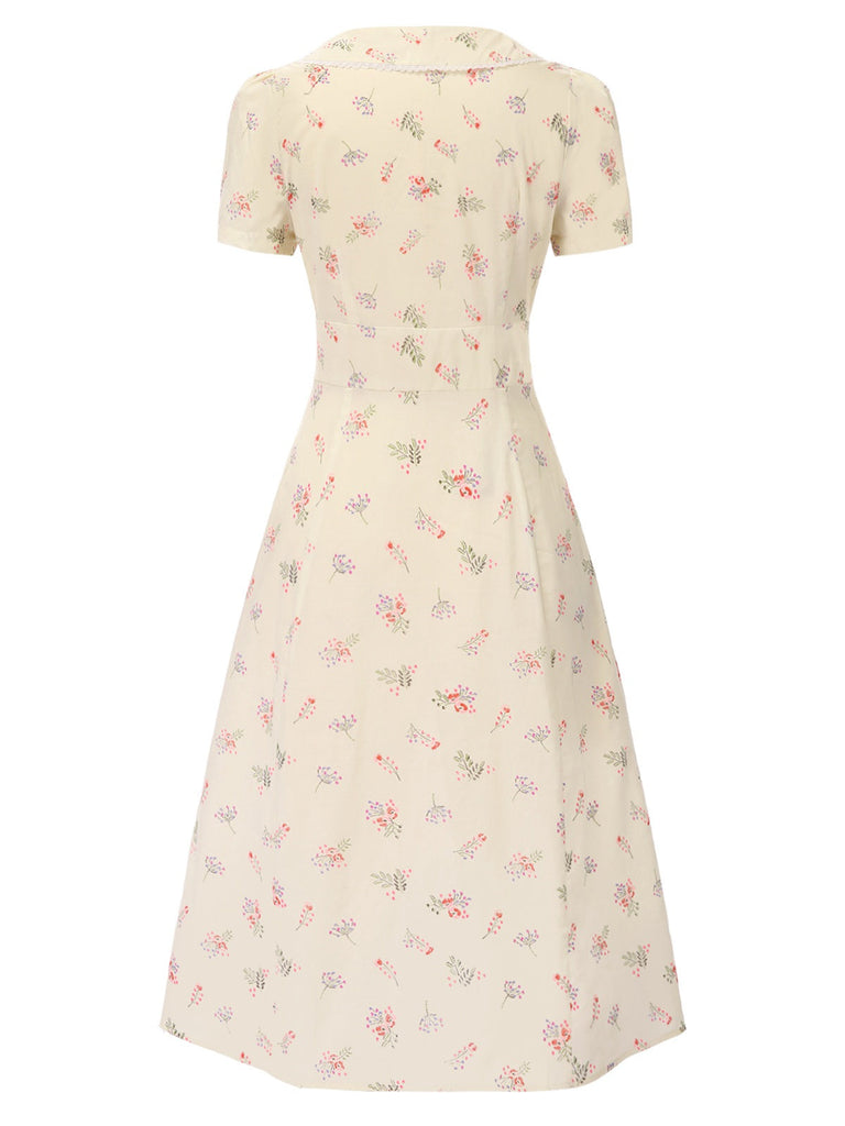 Robe beige à manches bouffantes et revers fleuris des années 1940
