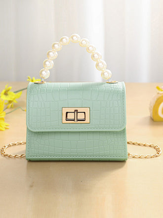 Sac à main à rabat en cuir texturé crocodile vert