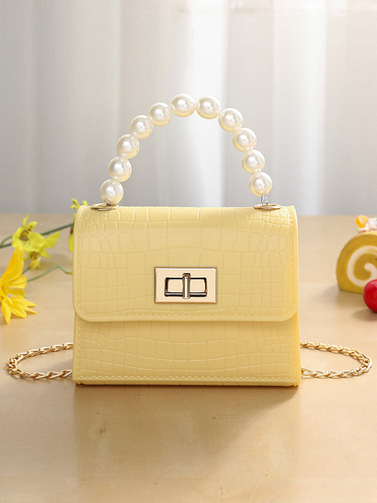 Sac à main à rabat en cuir texturé crocodile jaune