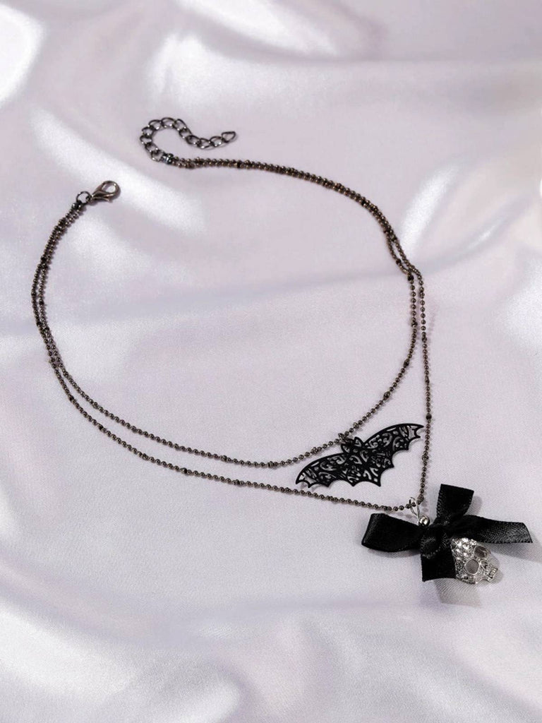 Collier double couche squelette de chauve-souris avec nœud gothique