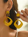 Boucles d'oreilles vintage en résine marbrée à motif géométrique exagéré