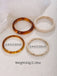 4PCS Ensemble de bracelets joncs empilables en résine marbrée ambre et ivoire - 4