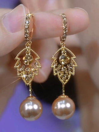 Boucles d'oreilles pendantes dorées à feuilles, strass et perles
