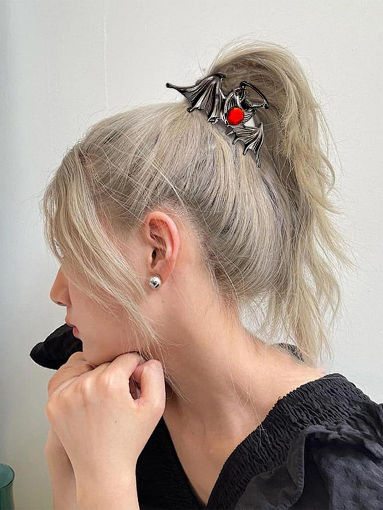 Pince à cheveux métallique gothique ailes de chauve-souris avec gemme rouge