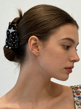 Pince à cheveux noire en forme de chat à motif floral