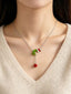 Collier avec pendentif main de Noël vert et rouge