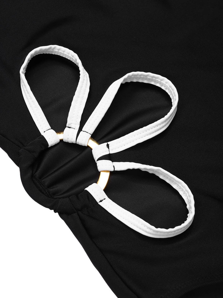 Maillot de bain une pièce noir creux à fleurs blanches des années 1950