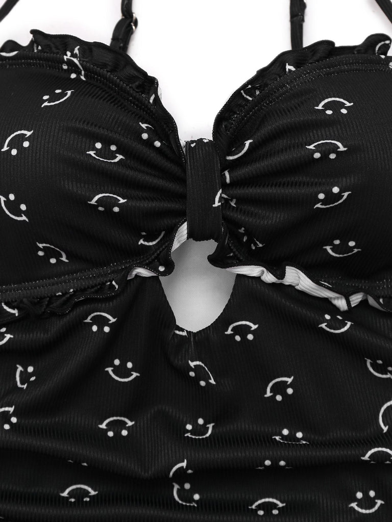 Maillot de bain une pièce noir à volants et bretelles imprimé sourire années 1930