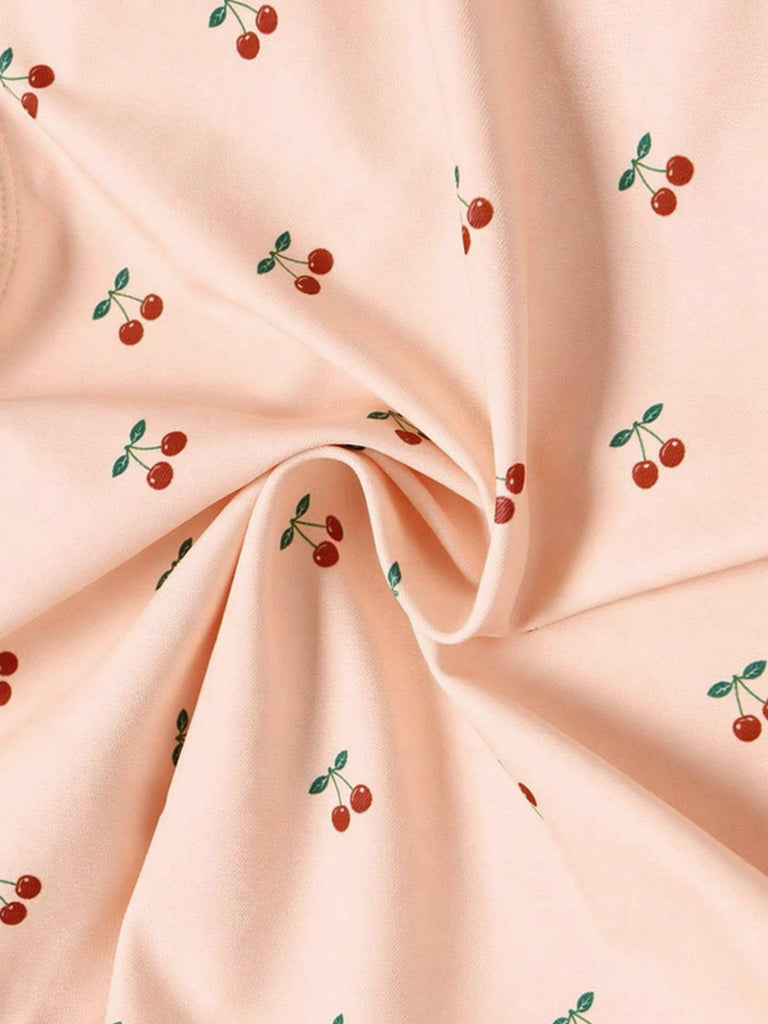 Maillot de bain une pièce rose en dentelle nœud cerise années 1950