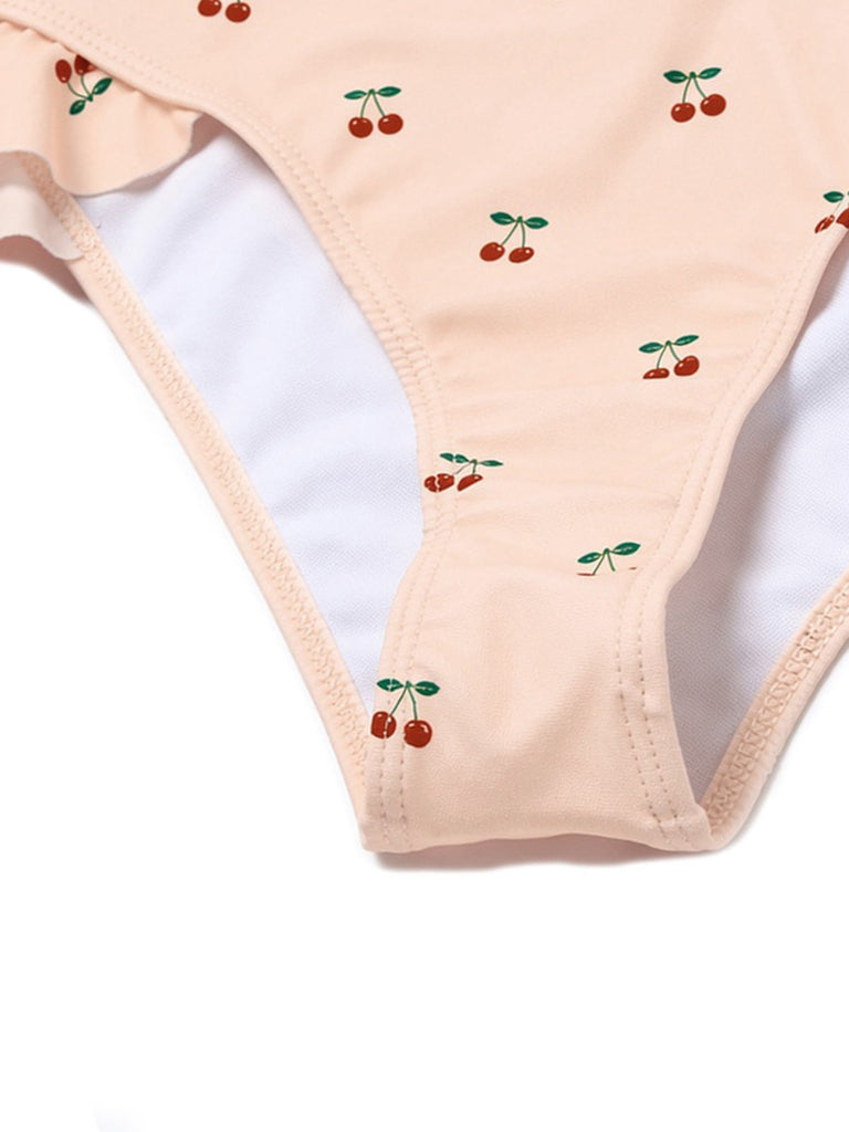 Maillot de bain une pièce rose en dentelle nœud cerise années 1950
