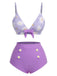 Maillot de bain violet à bretelles avec nœud marguerite des années 1950