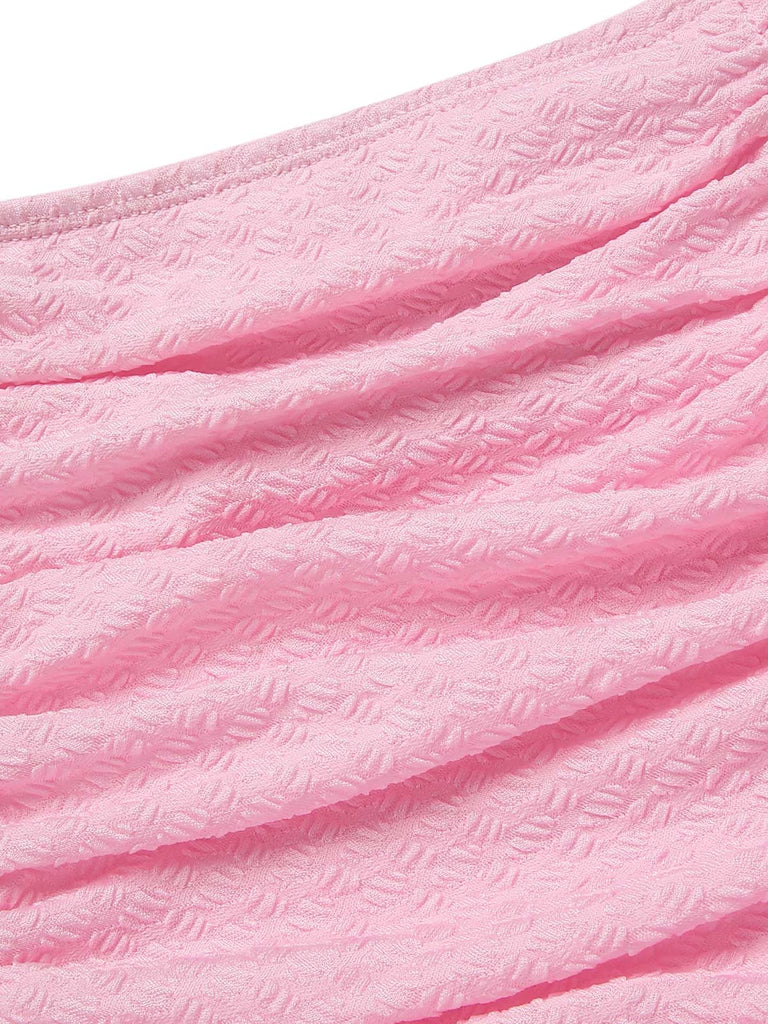 Maillot de Bain uni rose à bretelles et volants des années 1950