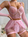 Ensemble lingerie rose en résille avec ras-de-cou et chaînes années 1980