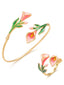 Parure composée d'un bracelet ouvert et d'une bague motif floral