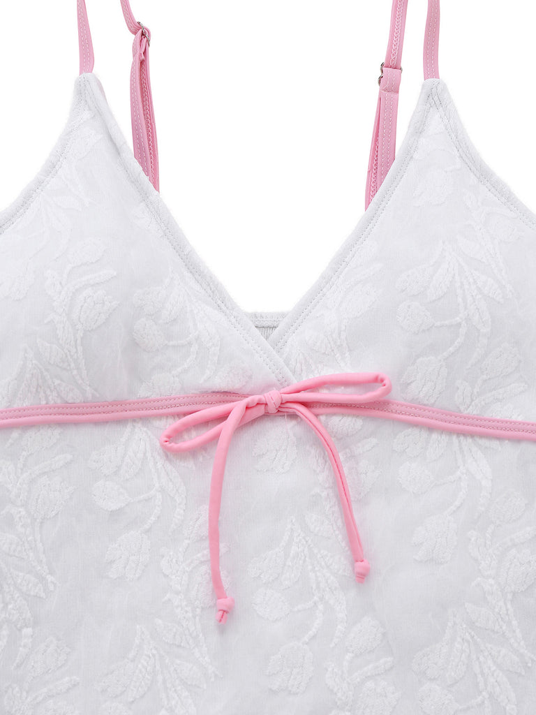 White textured Swimsuit with pink straps on a white background