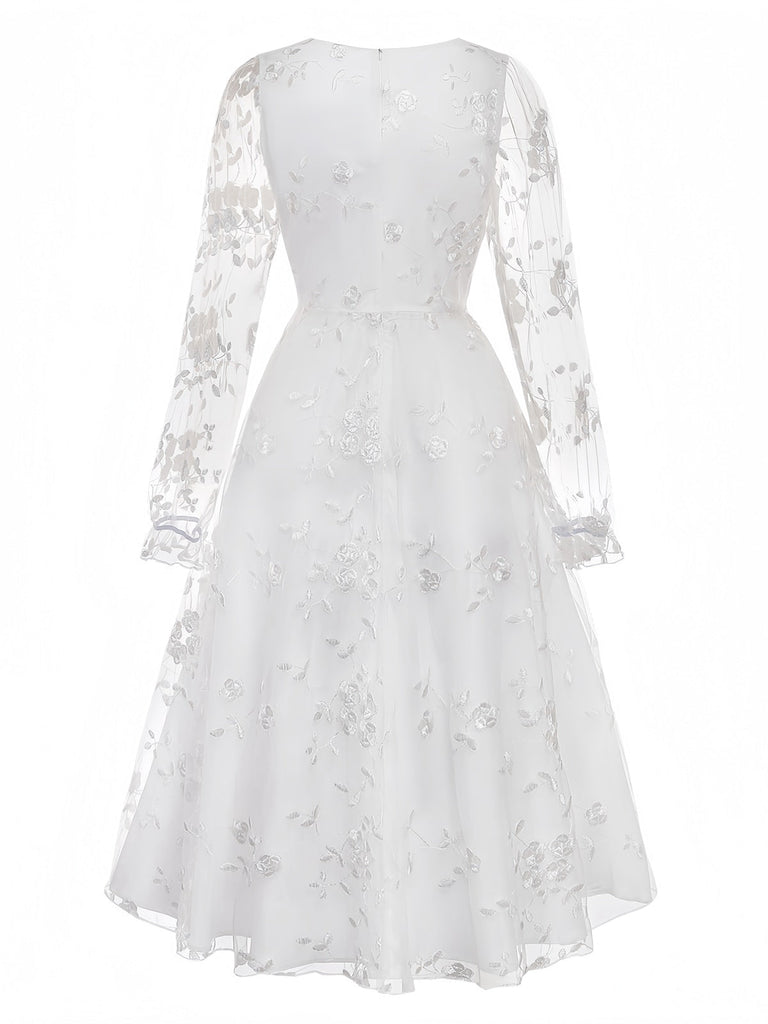 White vintage dress with floral embroidered lace and square neckline in 1950s retro style