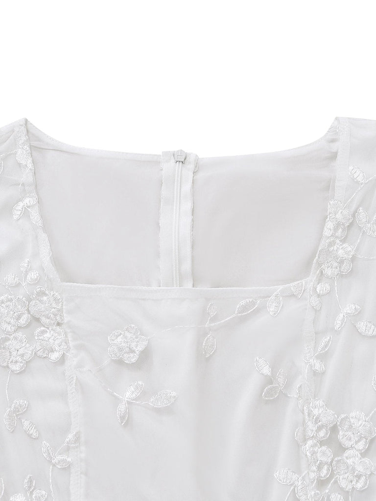 White vintage dress with floral embroidered lace and square neckline in 1950s retro style