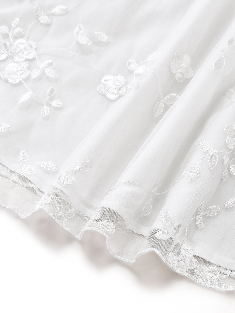 White vintage dress with floral embroidered lace and square neckline in 1950s retro style