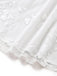 White vintage dress with floral embroidered lace and square neckline in 1950s retro style