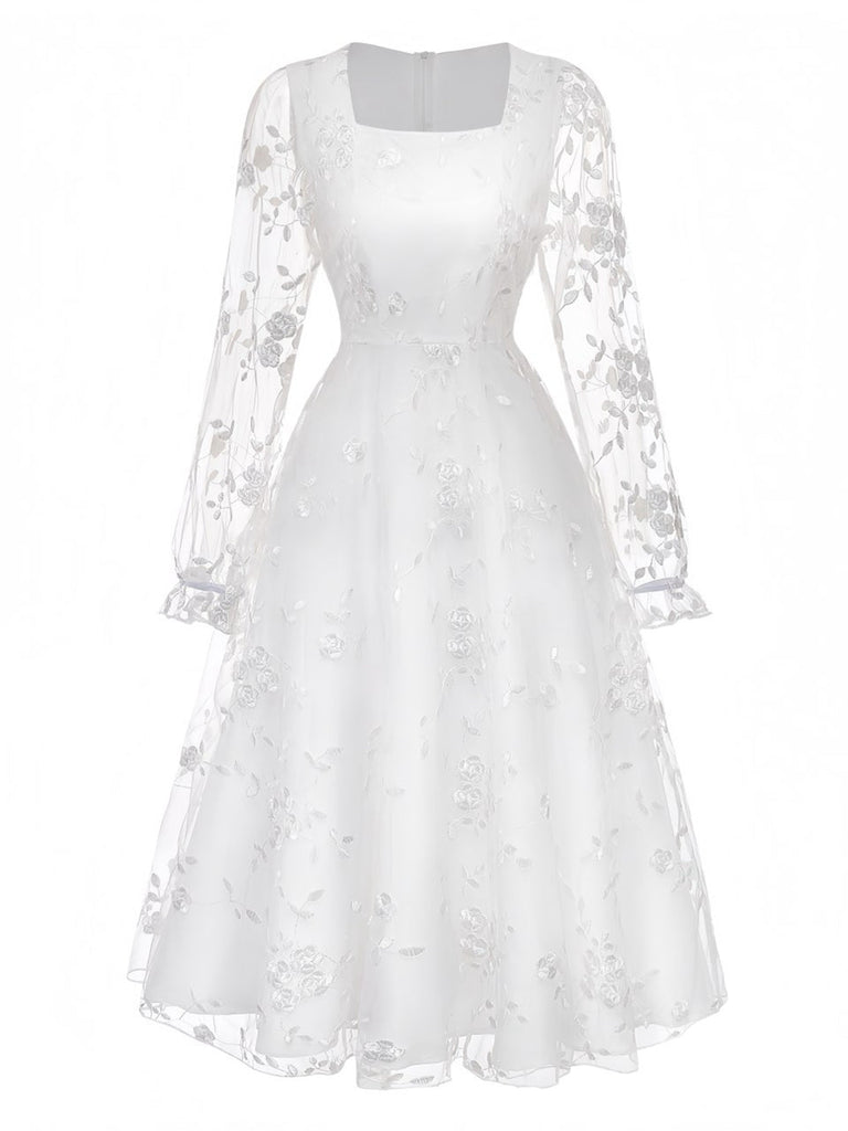 White vintage dress with floral embroidered lace and square neckline in 1950s retro style