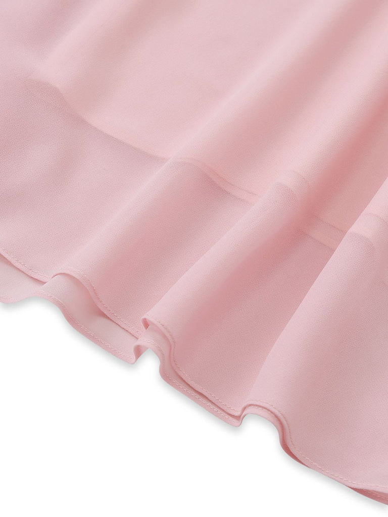 Close-up of the asymmetrical hemline and high-quality stitching on the layered chiffon skirt.