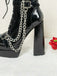 Bottes gothiques talons hauts vernis noir et ornées de chaînes