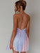 Rear view of a model wearing the rainbow sequin dress, highlighting the elegant backless look and delicate strap details.