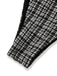 Close-up of a black and white checkered fabric with a frayed edge on a white background