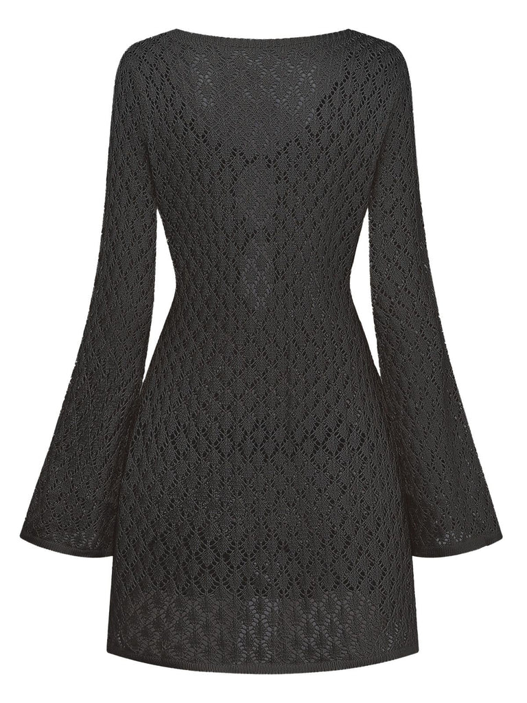 Back view of the black crochet bell-sleeve beach tunic on a white background.